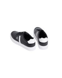 schwarze und weiße Leder niedrige Sneakers von Calvin Klein