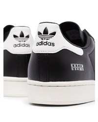 schwarze und weiße Leder niedrige Sneakers von adidas