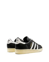 schwarze und weiße Leder niedrige Sneakers von adidas