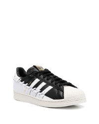 schwarze und weiße Leder niedrige Sneakers von adidas