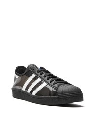 schwarze und weiße Leder niedrige Sneakers von adidas