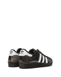 schwarze und weiße Leder niedrige Sneakers von adidas