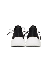 schwarze und weiße niedrige Sneakers von Prada