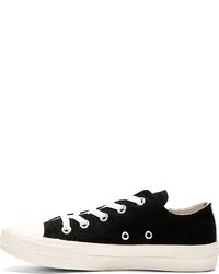 schwarze und weiße niedrige Sneakers von Comme des Garcons