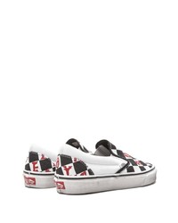 schwarze und weiße Slip-On Sneakers aus Segeltuch mit Karomuster von Vans