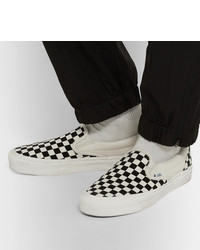 schwarze und weiße Slip-On Sneakers aus Segeltuch mit Karomuster von Vans
