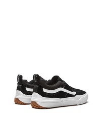 schwarze und weiße Slip-On Sneakers aus Wildleder von Vans