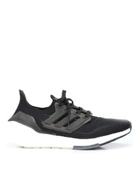 schwarze und weiße Sportschuhe von adidas