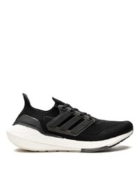 schwarze und weiße Sportschuhe von adidas