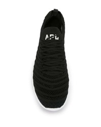 schwarze und weiße Sportschuhe von APL Athletic Propulsion Labs