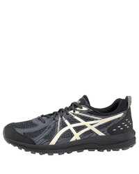 schwarze und weiße Sportschuhe von Asics