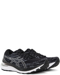 schwarze und weiße Sportschuhe von Asics