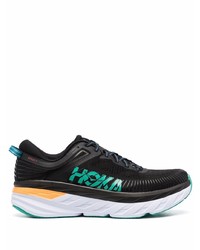 schwarze und weiße Sportschuhe von Hoka One One