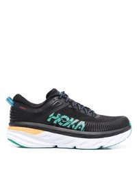 schwarze und weiße Sportschuhe von Hoka One One