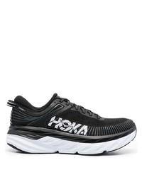 schwarze und weiße Sportschuhe von Hoka One One