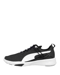 schwarze und weiße Sportschuhe von Puma