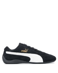 schwarze und weiße Sportschuhe von Puma