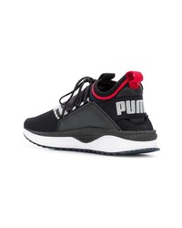 schwarze und weiße Sportschuhe von Puma