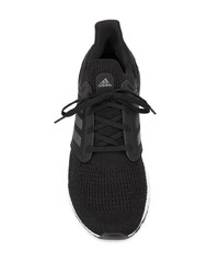 schwarze und weiße Sportschuhe von adidas