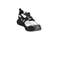 schwarze und weiße Sportschuhe von Under Armour