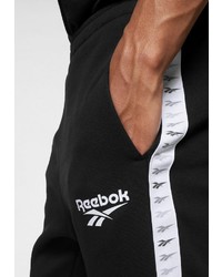 schwarze und weiße vertikal gestreifte Jogginghose von Reebok Classic