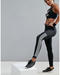 schwarze und weiße vertikal gestreifte Leggings von adidas