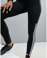 schwarze und weiße vertikal gestreifte Leggings von adidas