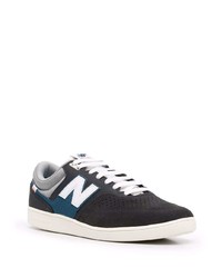 schwarze und weiße Wildleder niedrige Sneakers von New Balance