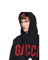 schwarzer bedruckter Pullover mit einem Kapuze von Gucci