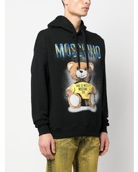 schwarzer bedruckter Pullover mit einem Kapuze von Moschino