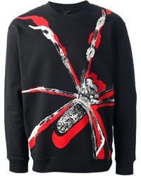 schwarzer bedruckter Pullover mit einem Rundhalsausschnitt von McQ by Alexander McQueen