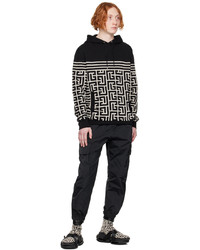 schwarzer horizontal gestreifter Pullover mit einem Kapuze von Balmain