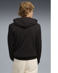 schwarzer Pullover mit einem Kapuze von Puma