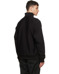 schwarzer Pullover mit einem Reißverschluss am Kragen von CARHARTT WORK IN PROGRESS