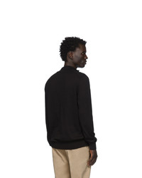 schwarzer Pullover mit einem Reißverschluss am Kragen von BOSS