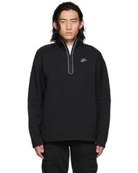 schwarzer Pullover mit einem Reißverschluss am Kragen von Nike