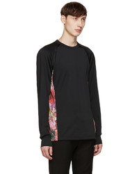 schwarzer Pullover mit einem Rundhalsausschnitt aus Netzstoff mit Blumenmuster von Comme des Garcons