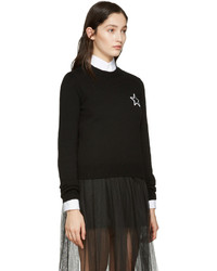 schwarzer Pullover mit einem Rundhalsausschnitt mit Sternenmuster von Givenchy