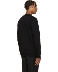schwarzer Pullover mit einem Rundhalsausschnitt von Versus