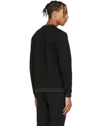 schwarzer Pullover mit einem Rundhalsausschnitt von Versus