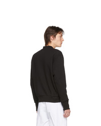 schwarzer Pullover mit einem V-Ausschnitt von Boramy Viguier
