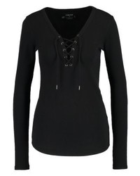 schwarzer Pullover mit einem V-Ausschnitt von Volcom