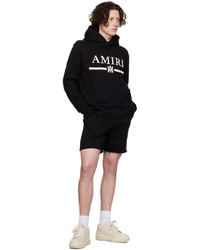 schwarzer und weißer bedruckter Pullover mit einem Kapuze von Amiri