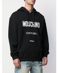 schwarzer und weißer bedruckter Pullover mit einem Kapuze von Moschino