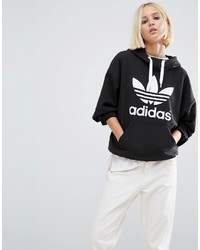 schwarzer und weißer bedruckter Pullover mit einer Kapuze von adidas