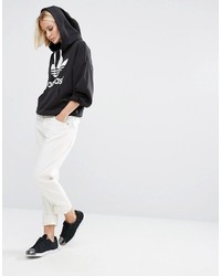 schwarzer und weißer bedruckter Pullover mit einer Kapuze von adidas