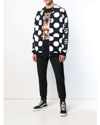 schwarzer und weißer gepunkteter Pullover mit einem Kapuze von Moschino