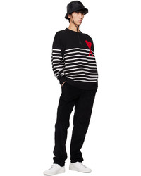 schwarzer und weißer horizontal gestreifter Pullover mit einem Rundhalsausschnitt von AMI Alexandre Mattiussi
