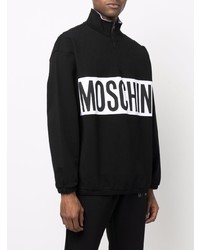schwarzer und weißer Pullover mit einem Reißverschluss am Kragen von Moschino