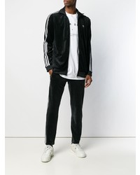 schwarzer und weißer Pullover mit einem Reißverschluß von adidas
